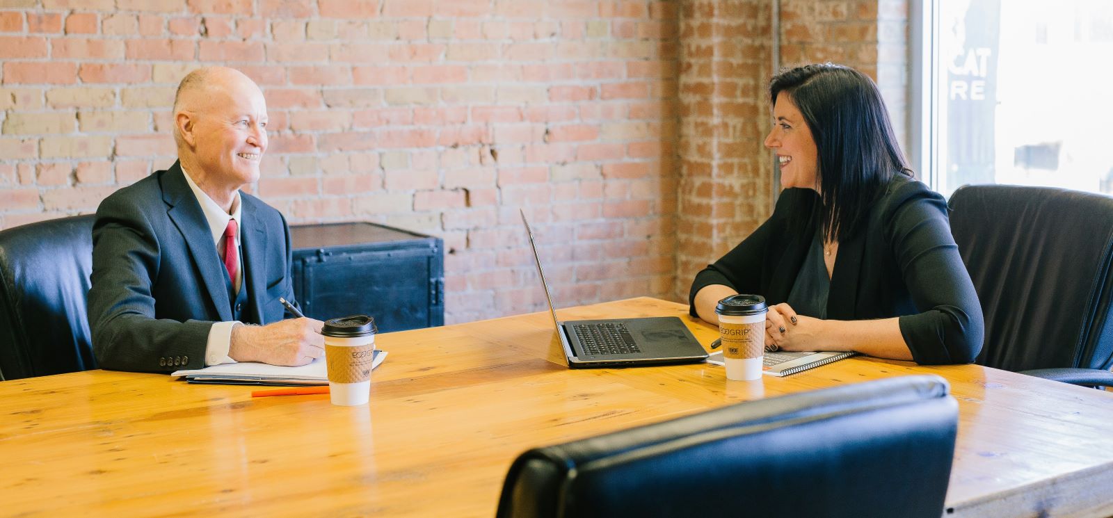 Man and lady in a conference room